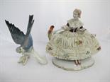 CONTINENTAL PORCELAIN, lace encrusted figure of lady reading with exotic bird by Unterweissbach,