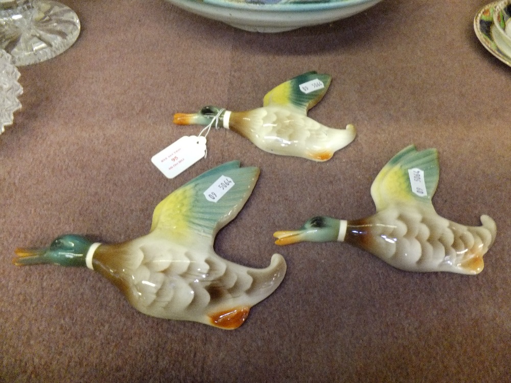 A group of three Keele Street Pottery graduated flying ducks
