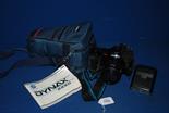 A cased Minolta Dynax 7000i camera with flash and AF zoom 35/70 and instruction booklet