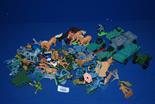 A quantity of plastic soldiers, army trucks, horses, gun carriages etc.,