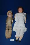 An early Doll with wax head and straw filled body, a/f, 17 1/2" tall, and an H & L Doll with