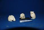 A tiny carved Ivory elephant, bone owl and an ivory Netsuke in the form of a long eared rabbit
