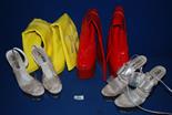 A selection of stylish Boots including a pair of yellow vinyl with cut out flower on leg, high wedge