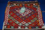 A Persian Camel Saddle in bright colours