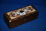 A box inlaid with brass, stone and shell having Karlsbad in the centre
