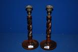 A pair of turned wooden barley twist Candlesticks, 13'' high