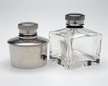 TWO OIL BOTTLES one nickel plated with 1 3/4in. diameter the other glass 1 3/4in. square both