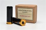 JAMES PURDEY & SONS A NEW AND UNUSED PAIR OF BRASS AND HORN 20-BORE SNAP CAPS signed `JAMES PURDEY &