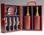 RAY PAVON A CASED CHAMPAGNE SET comprising of four glasses four coasters two coolers corkscrew and