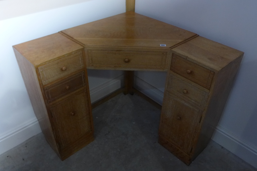 A Heal & Son Ltd, London lime oak corner dressing table with five