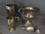 Four silver Trophy cups - Total weight approx. 22.5 troy oz 
Condition report:  One broken