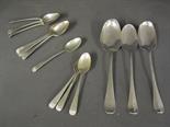 A set of silver teaspoons, three matching and a single teaspoon - all with normal usage wear and