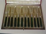 A cased set of six silver and green stained ivory handle cake knives and forks - Sheffield 1913 - 14