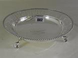 A silver presentation bowl with pierced border and scroll feet - Diameter 21 cm - Hallmarked