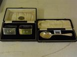 A pair of silver napkin rings - boxed and a single silver spoon - boxed - Total silver weight