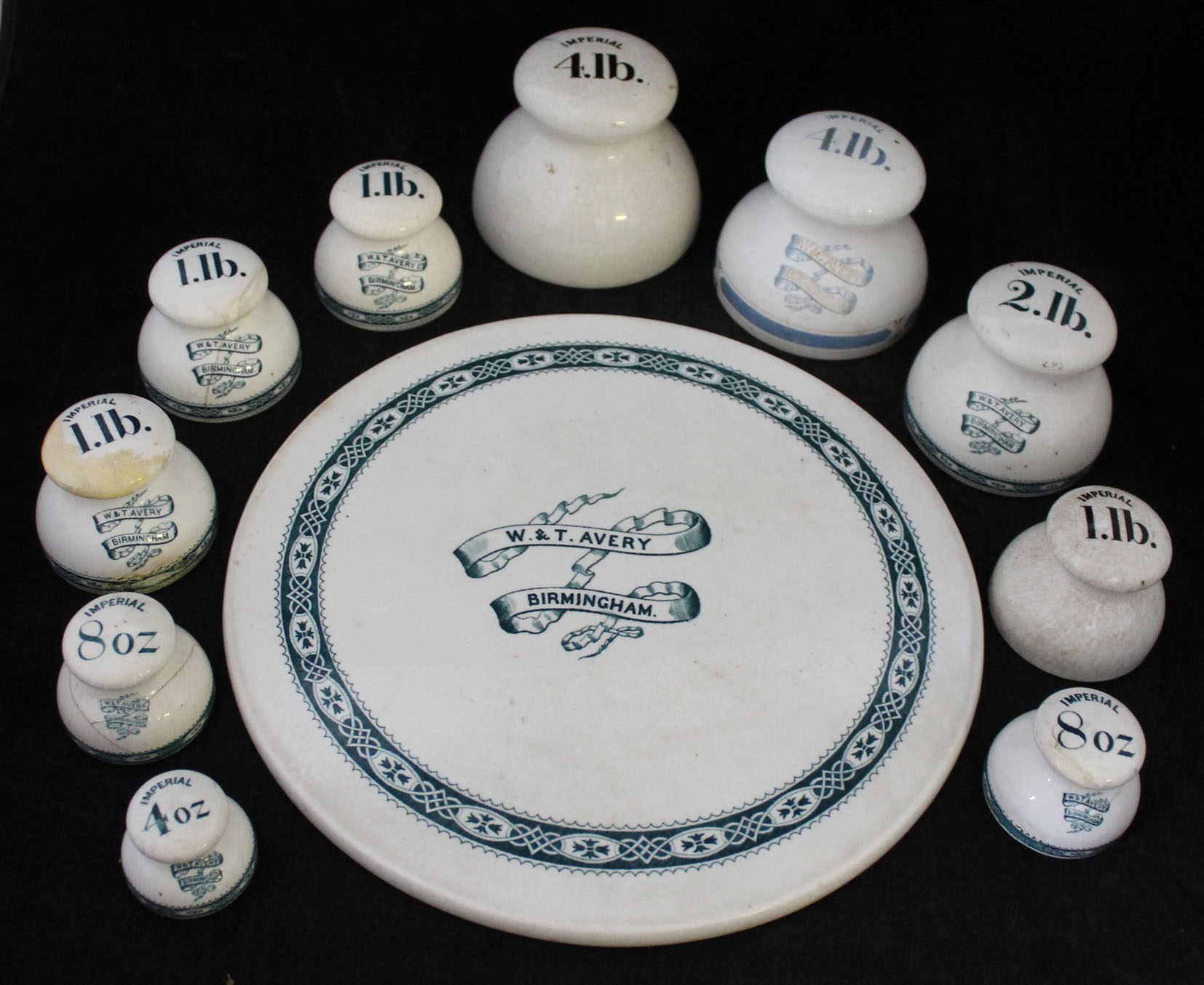 A rare set of W & T Avery of Birmingham ceramic weights and circular
