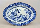 A Chinese blue and white oval dish decorated with exotic birds in a flowery landscape, 33.5 x 25 cm,