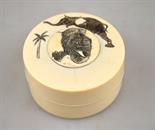 A Japanese ivory cylindrical box and cover decorated with an elephant, 6.5 cm dia.   Condition