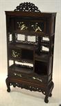 A Japanese open display cabinet comprising two cupboards above two small drawers, the sliding