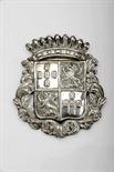 A saddlery Plaque, silver gilt metal, relief decoration with the coat of arms of the Sousa, do Prado