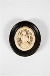A Female Figure, pierced and carved ivory medallion, ebonised wooden frame, German, 19th C.Dim. -