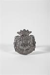 A Saddle plate, silver plated metal, relief decoration with the coat of arms of the marquesses of