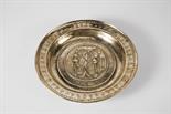 An Alms Dish, Nuremberg, yellow metal, relief and engraved decoration "Adam and Eve", rim with
