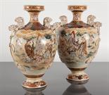 PAIR OF JAPANESE SATSUMA VASES with figural decoration and foe dog ring handles, each 24cm high