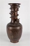 LARGE CHINESE BRONZE VASE the neck with dragon wrapped round in relief, the body with four panels,