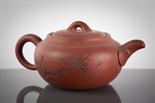CHINESE TERACOTTA TEAPOT with blossom and character decoration, mark to base, 17cm long