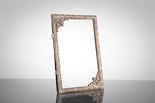 EGYPTIAN WHITE METAL PHOTOGRAPH FRAME the frame with leaf motifs all round, 15.5cm x 10cm