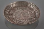 PERSIAN ISLAMIC WHITE METAL PLATE with stylised decoration, mark to base, 24cm diameter