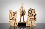 THREE JAPANESE IVORY FIGURES depicting a female with a fan (her face rotating between good and