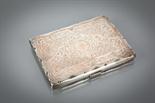 SILVER CASED NECESSAIRE with stylised intertwining floral decoration, the interior in blue with card