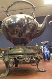 MID-VICTORIAN SILVER PLATED KETTLE ON STAND of large proportions with hinged lid and embossed with