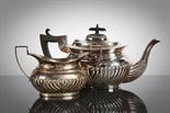 EDWARDIAN SILVER TEAPOT AND SUGAR BOWL each of oval form and partially gadrooned, with silver gilt