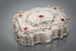 LATE 19TH CENTURY CONTINENTAL SILVER CASKET of rectangular form, the hinged lid with a raised