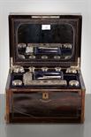 GENT`S VICTORIAN SILVER MOUNTED TRAVEL TOILET BOTTLE SET cased in coromandel and inlaid with brass