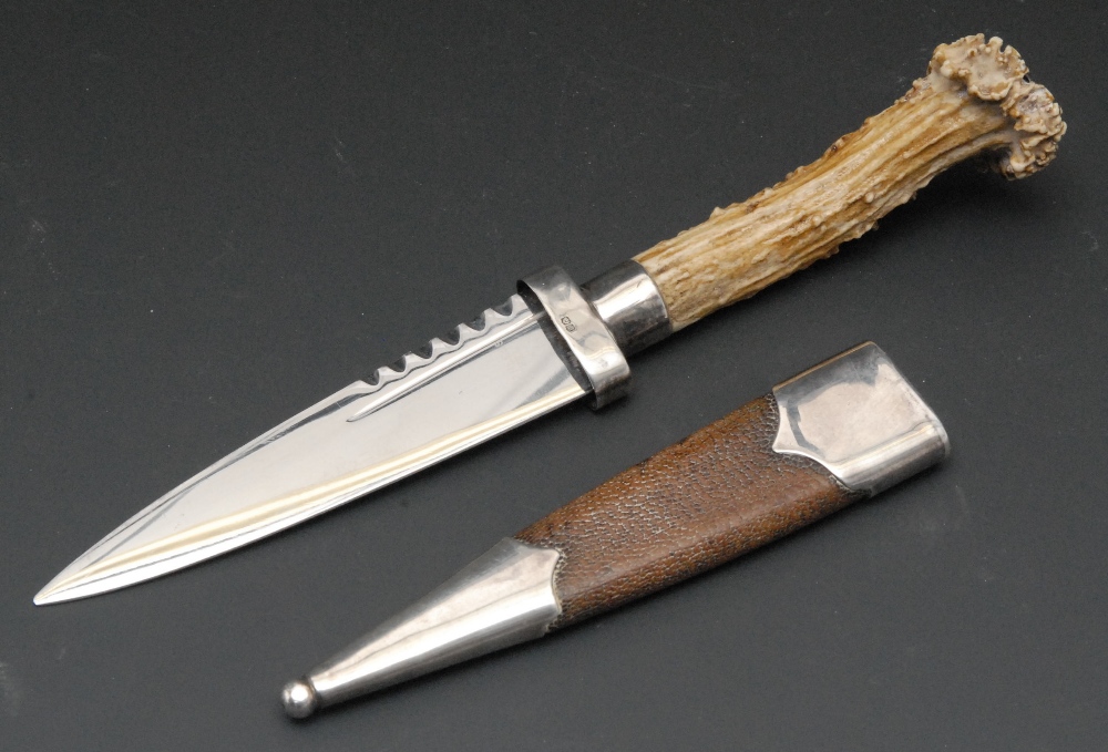 A Scottish Highlander`s sgiandubh or sock dagger, 9cm blade, stag