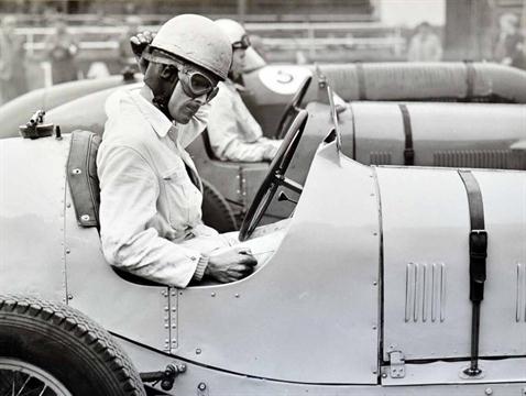 2x large motor racing b&w photographs – to incl 1930 Racing driver at the wheel before the start