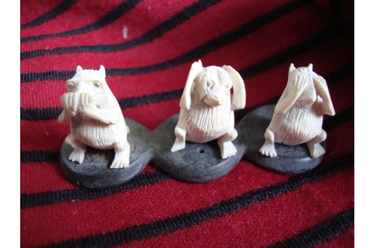 Gandhi delicately carved miniature figures representing the Three Wise Monkeys (‘Speak no Evil;