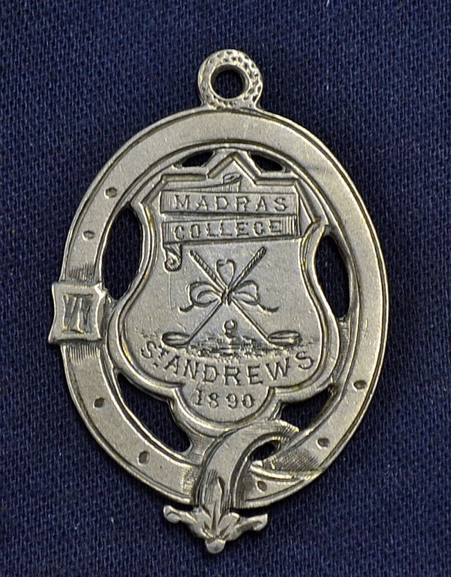 1890 Madras College St Andrews Golf Club white metal medal – oval shaped medal engraved with cross