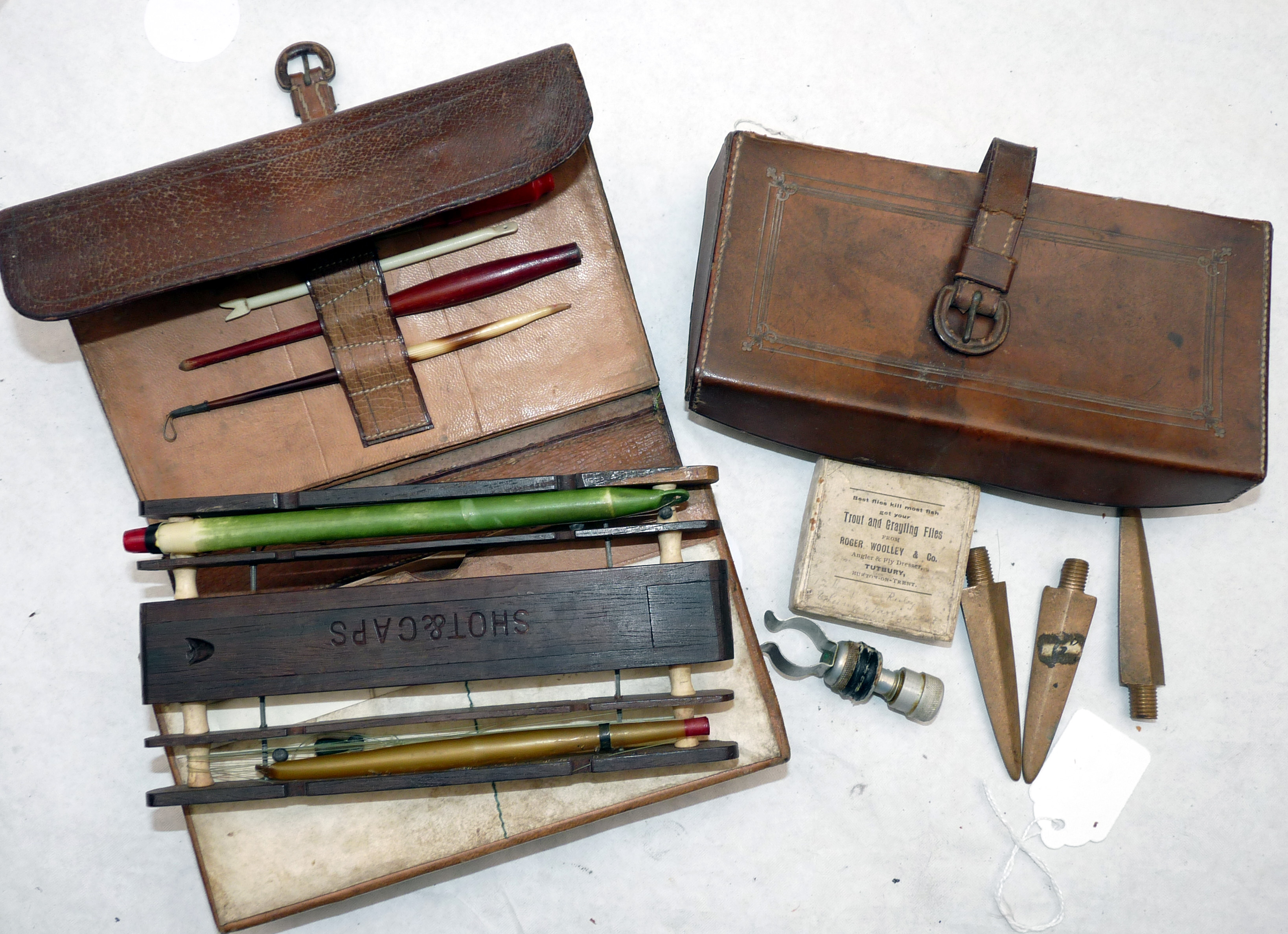 ACCESSORIES (Qty): Early leather bound coarse fisherman’s wallet with central box holding a fine