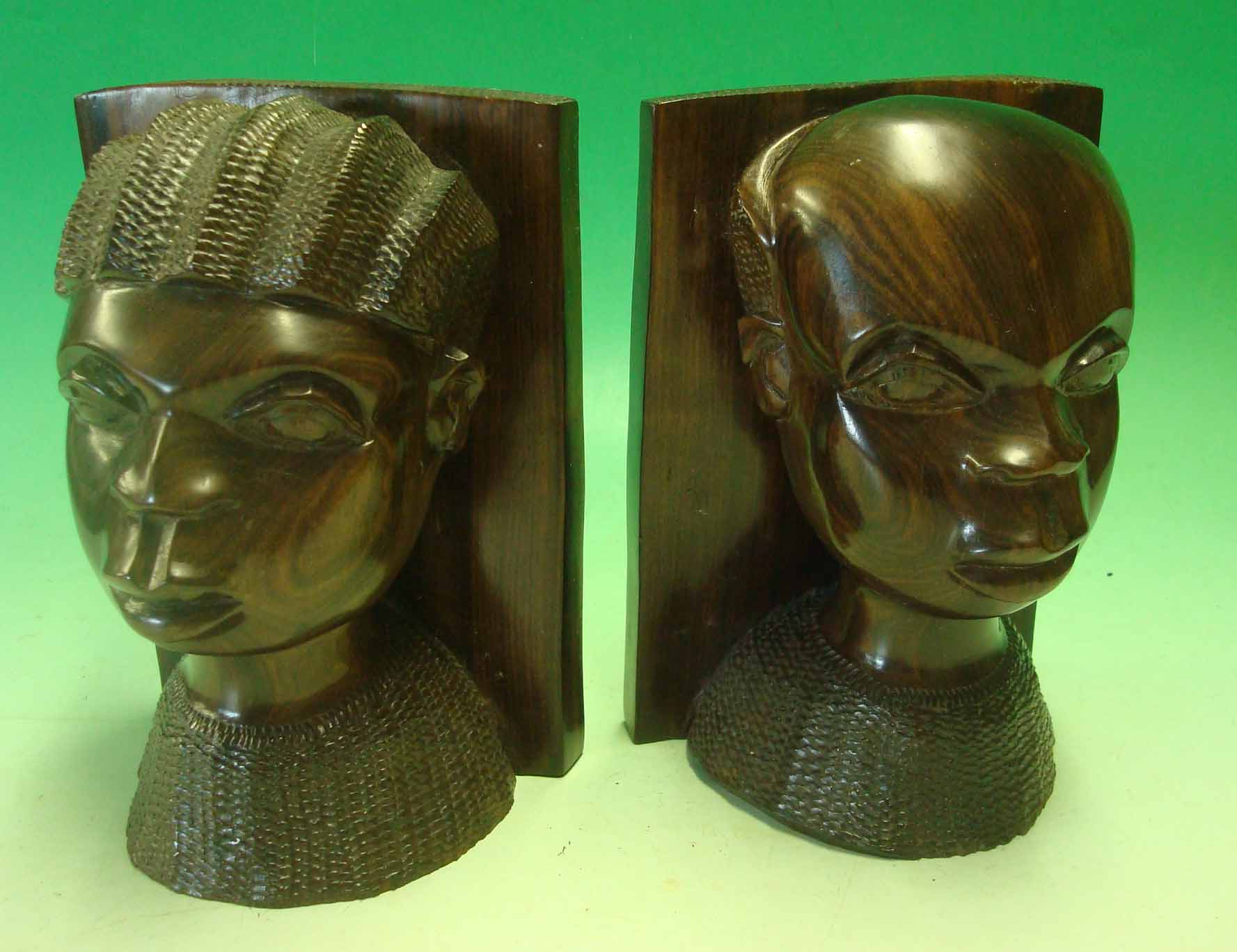Pair of African Carved Bookends: Male and Female busts with panel to rear caved each been carved