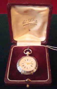 Ladies Silver Fob Watch: French pie crust edged enamel faced fob watch with gold hands and detail
