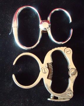 Two Pairs of Wrist Restraints: Police issue wrist grips 2 variations both in chrome finish