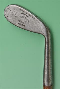 An interesting Tom Stewart made cleek featuring an unusual elongated oval shaped head, stamped