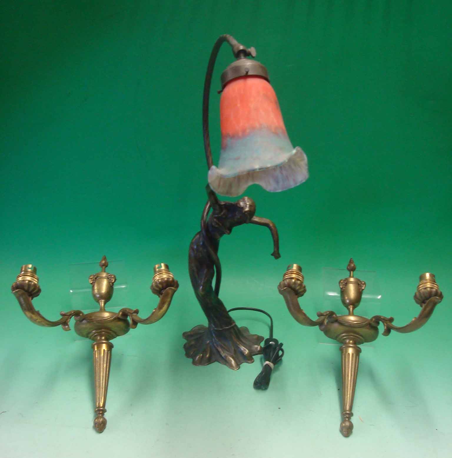 Ornate Cast Lamp: Having a Woman for central base with rope design holding the lamp over the top54cm