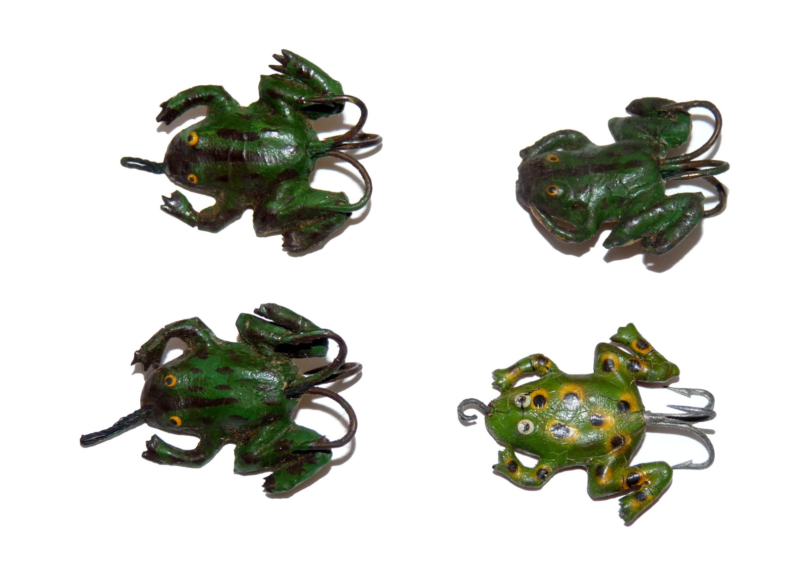 LURES (4): Collection of 4 early hard rubber frog lures, sizes around 1”, with single and treble