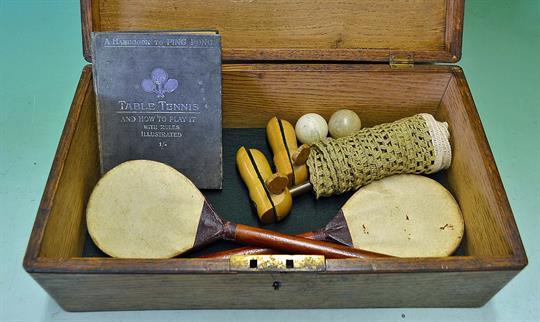 Early 20th c Table Tennis boxed set – to incl fruit wood posts, early net, 2x vellum bats, balls and